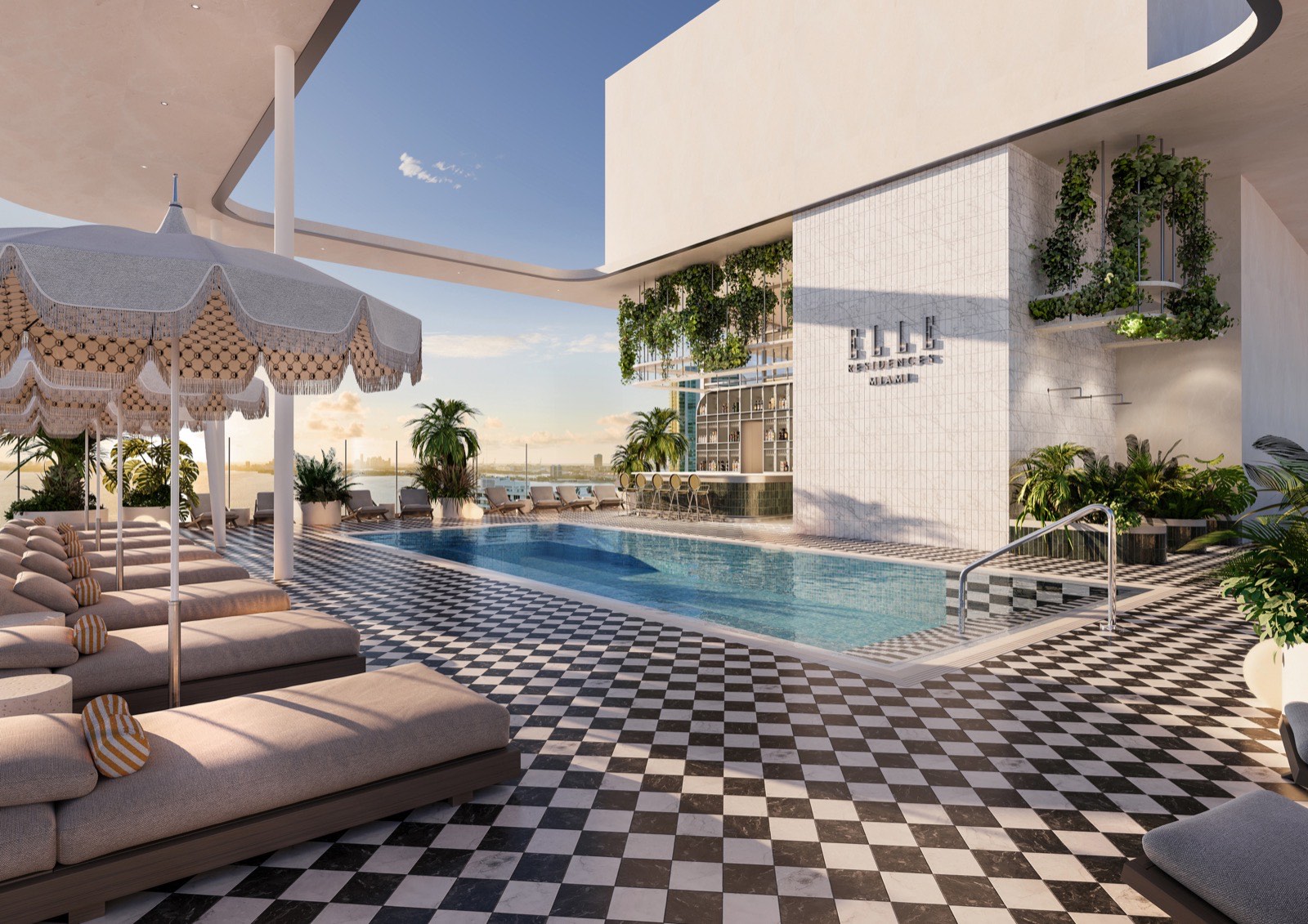 The Sommet rooftop Sky Pool on the 25th floor of ELLE Residences Miami at sunset